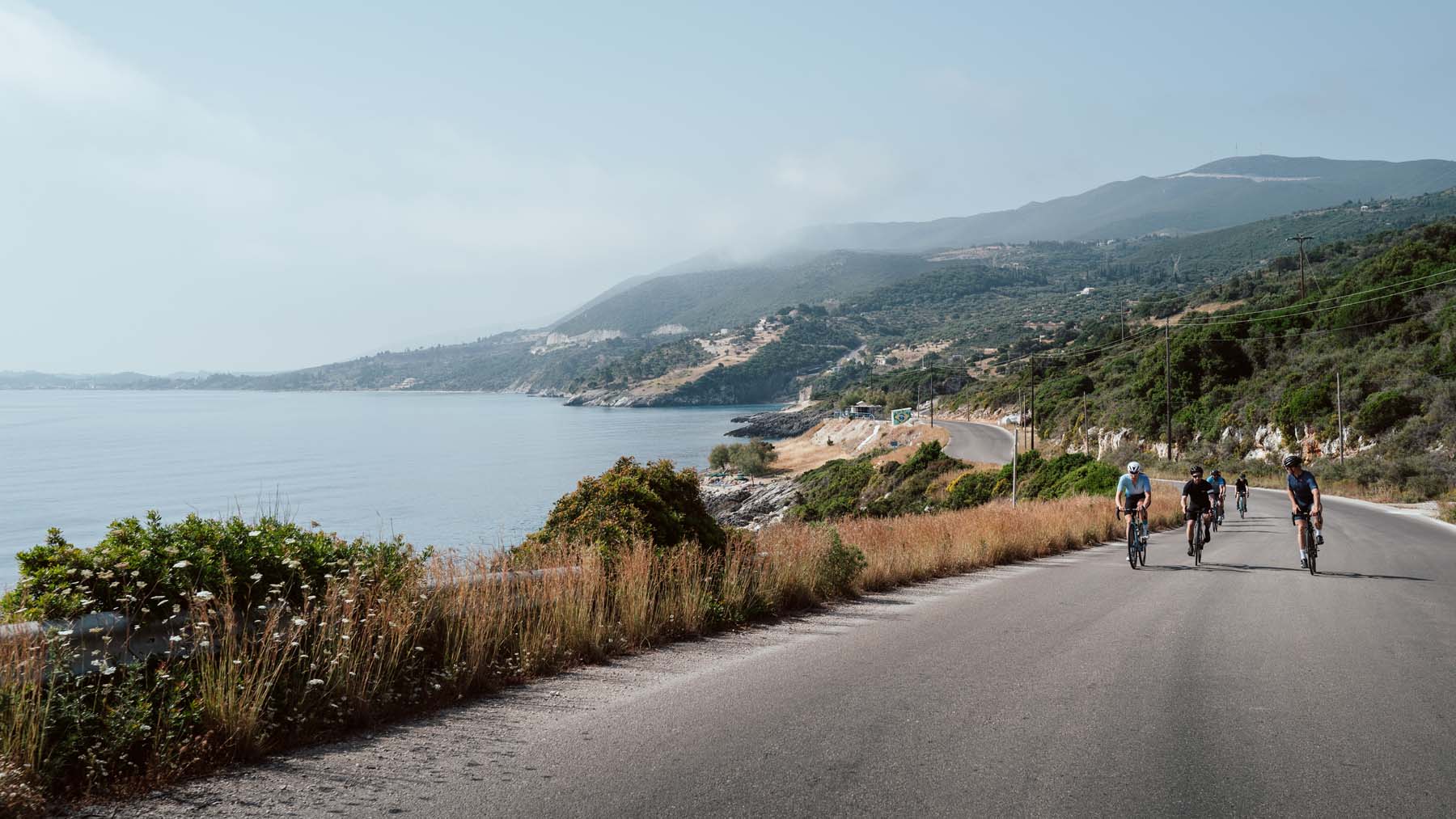 Road cyclists on a coastal road