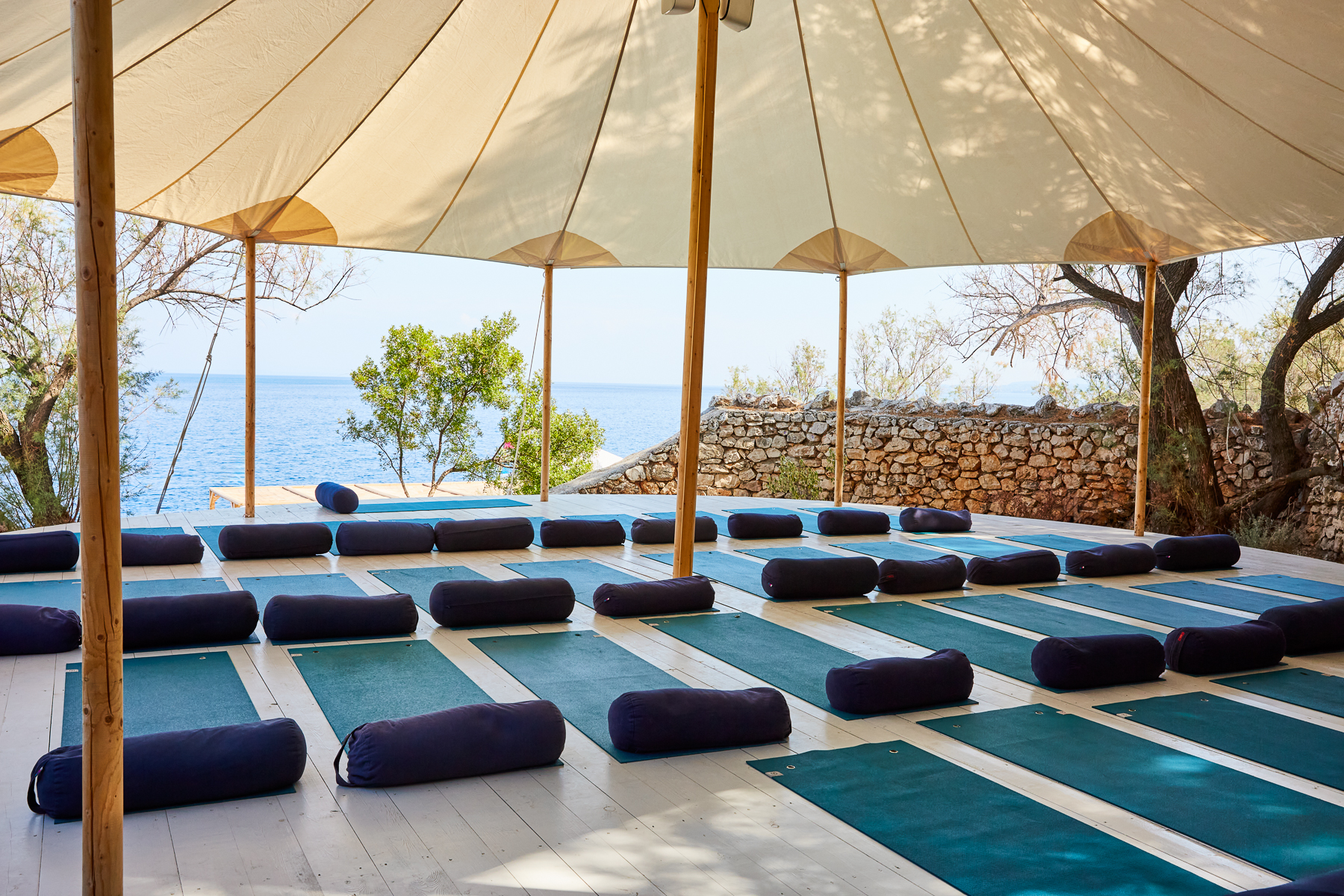 a yoga deck with a sea view