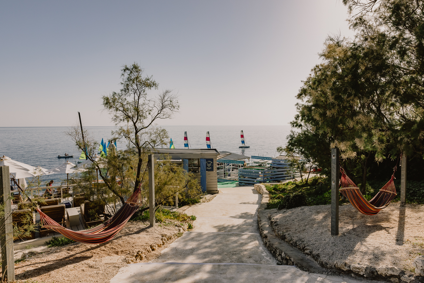 Pathway to the sea with a hammock